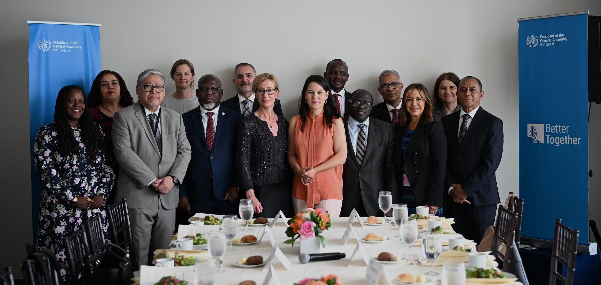 Delegates pose together after a lunch in the United Nations Goals Lounge.