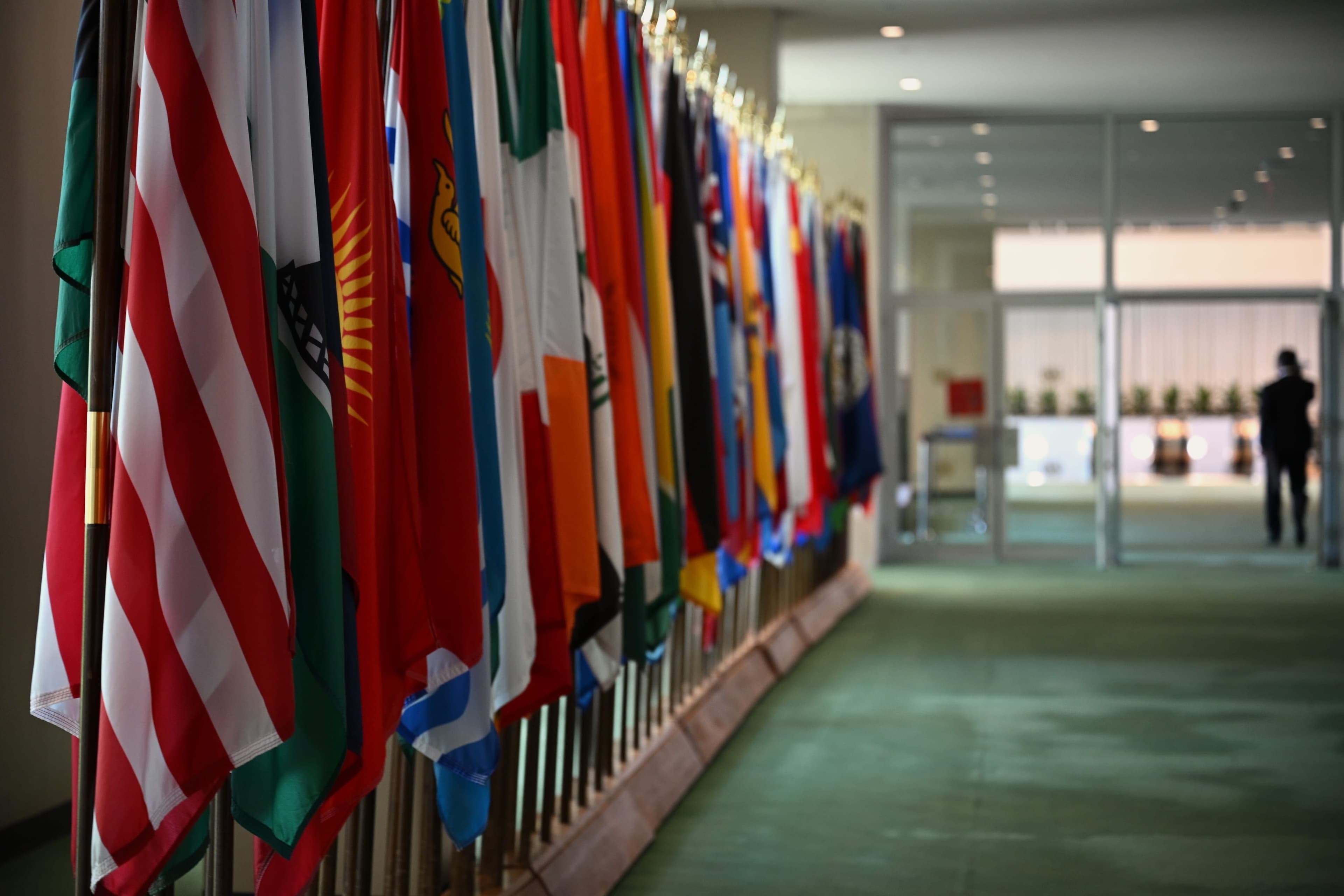 National flags line a corridor inside United Nations Headquarters.