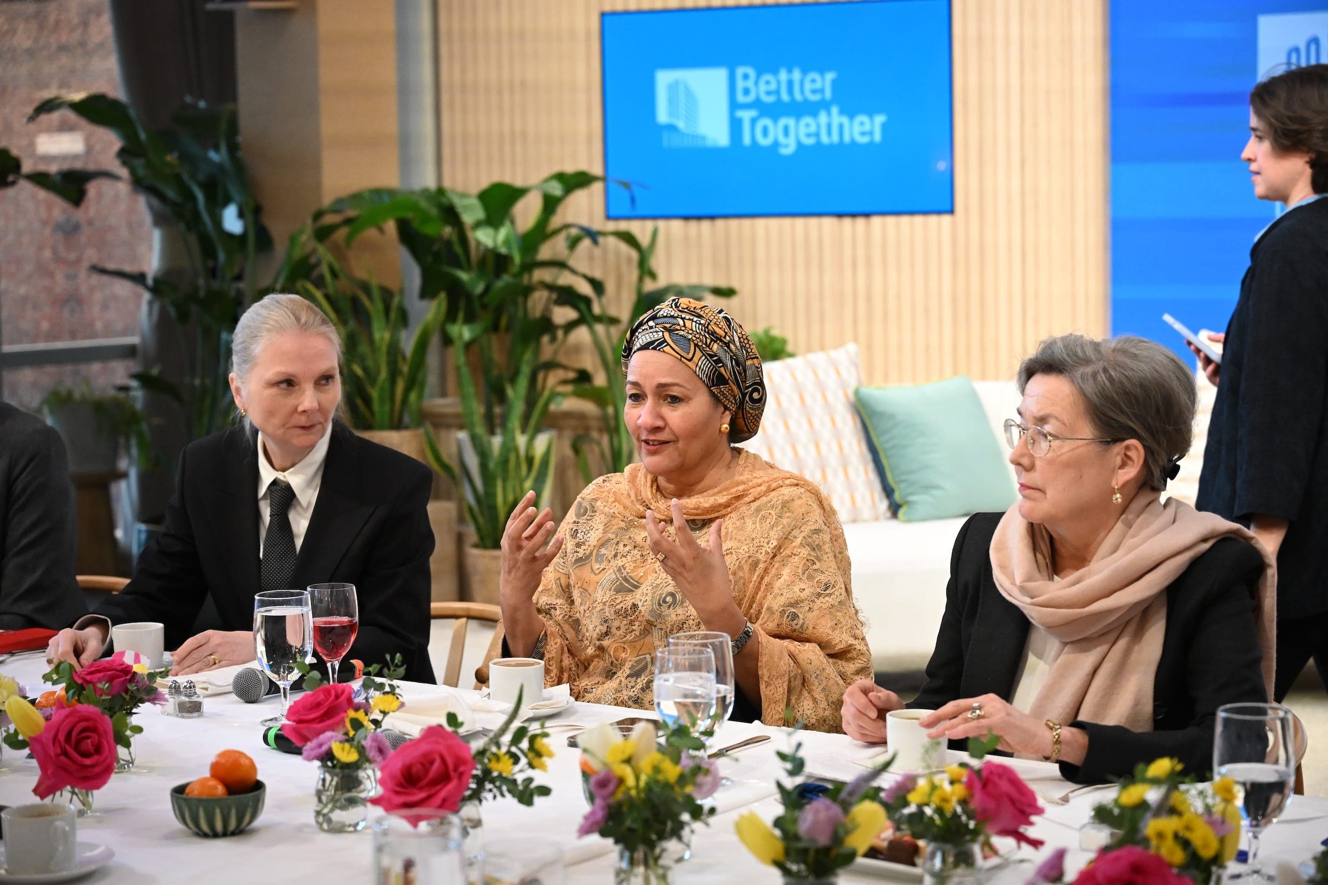 Three women take part in a round-table discussion in the United Nations Goals Lounge.