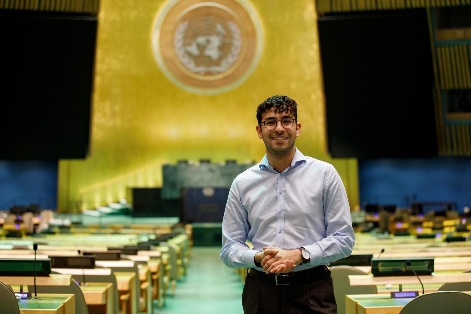 Emirhan Dalci standing in the United Nations General Assembly Hall